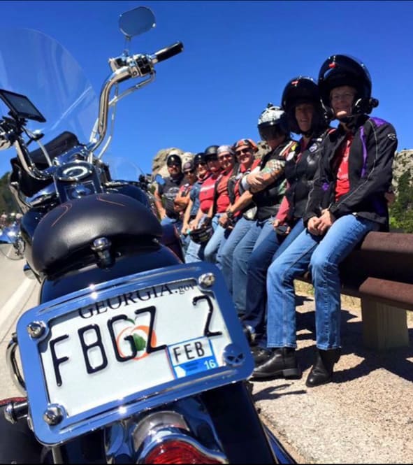 A group photo of some FBGz members with a bike in the foreground