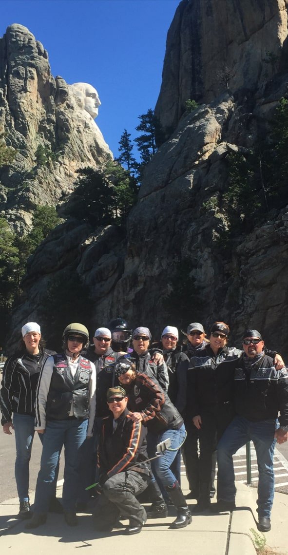 A group photo of some FBGz members in front of some beautiful scenery