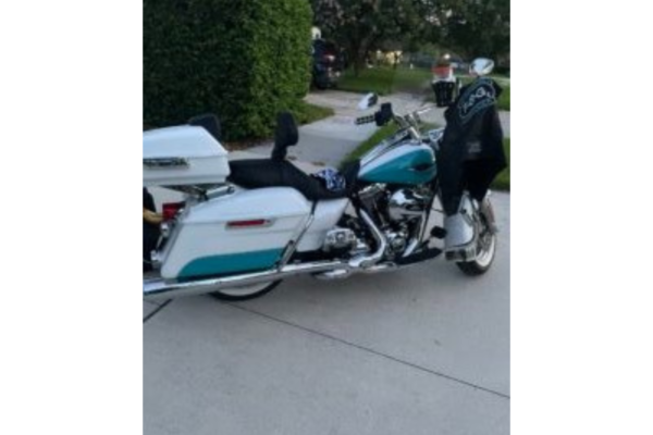 Motorcycle with leather jacket hanging on handle bars